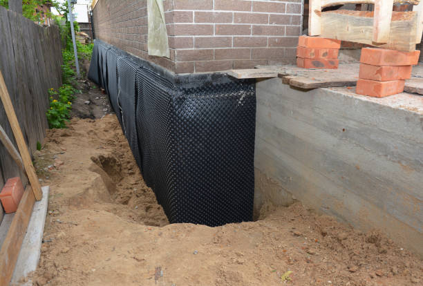 Happy homeowners after waterproofing job in Shepherd